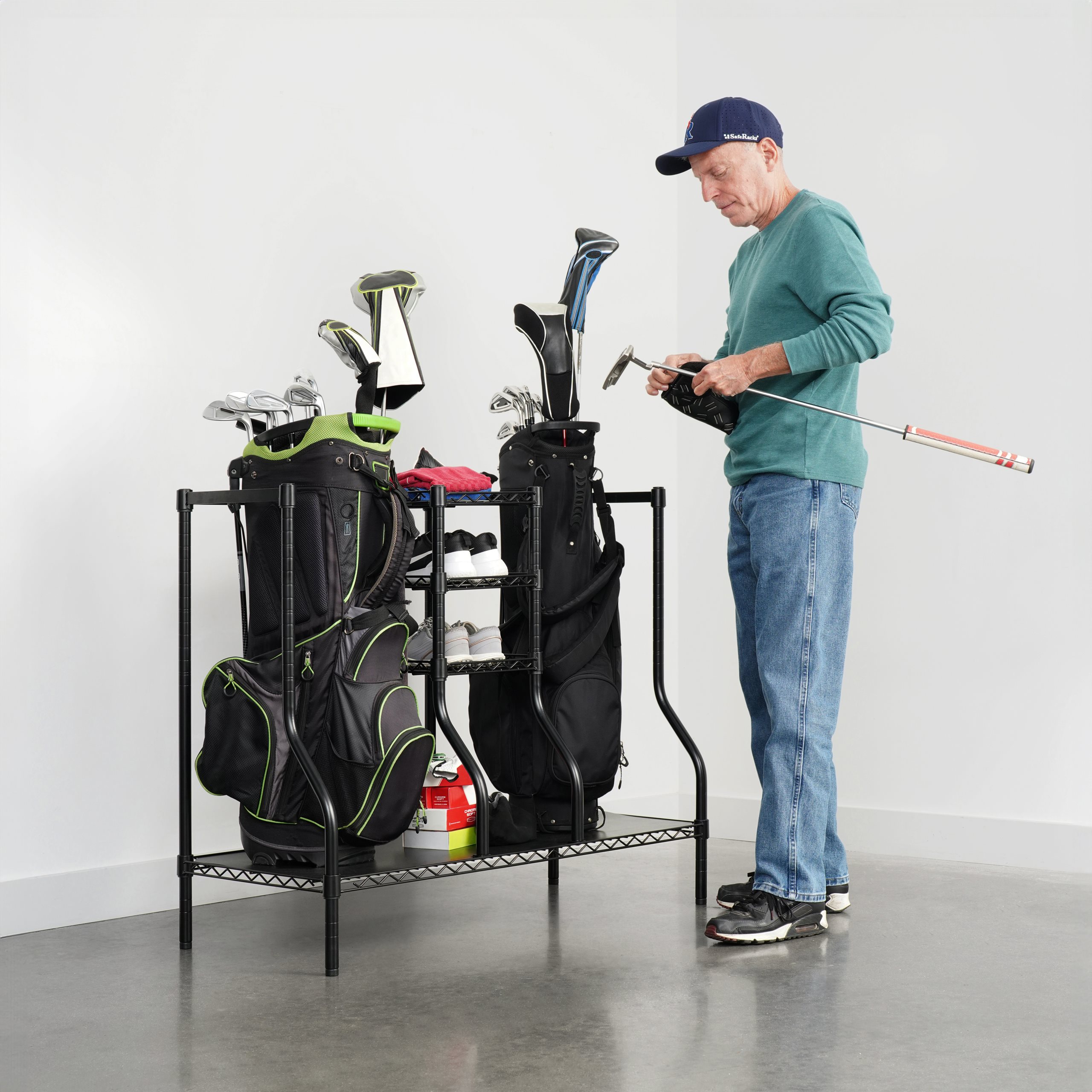 slide 1 of 4, show larger image, man storing golf club and bags on golf rack