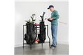 slide 1 of 4, zoom in, man storing golf club and bags on golf rack